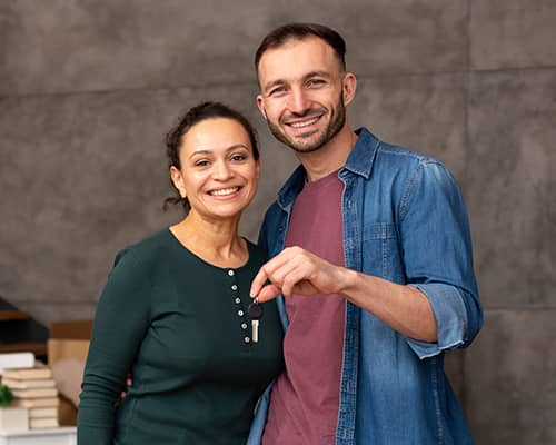 Happy couple moving into their new home